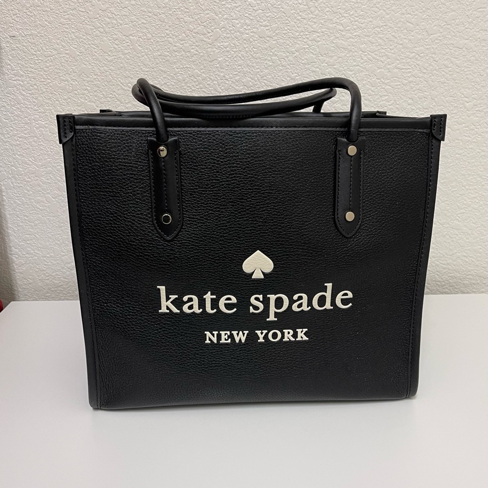 kate spade black tote with white logo and spade